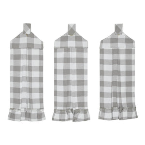 Three gray and white checkered aprons on a white background