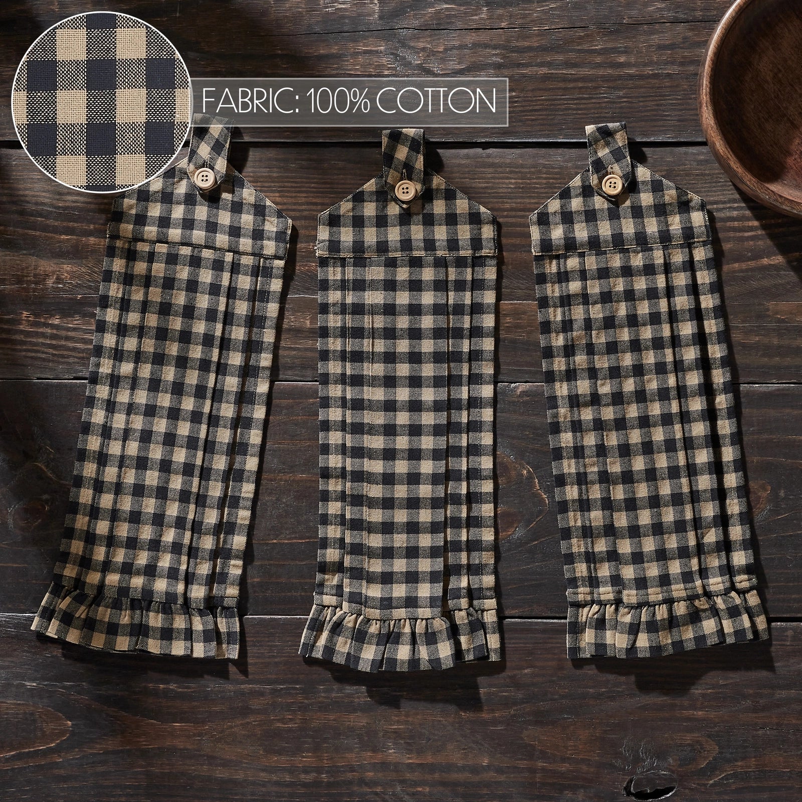 Three matching plaid fabric pouches or small bags laid flat on a dark wooden surface, with a circular fabric close-up in the top left and text reading 'FABRIC: 100% COTTON'. No person or animal is present, so this is Product/Packaging rather than Lifestyle.