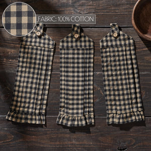 Three matching plaid fabric pouches or small bags laid flat on a dark wooden surface, with a circular fabric close-up in the top left and text reading 'FABRIC: 100% COTTON'. No person or animal is present, so this is Product/Packaging rather than Lifestyle.