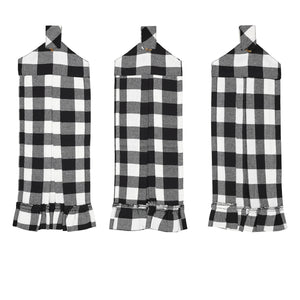 Three black and white buffalo plaid apron covers shown flat against a white background, each with a top loop and ruffled hem.