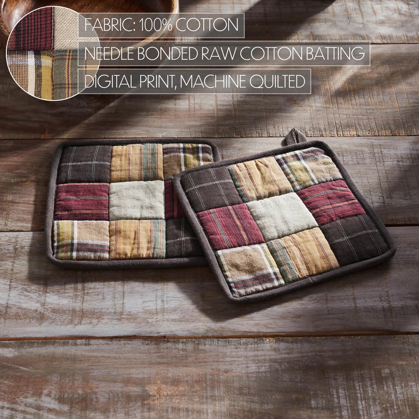 Two square patchwork quilted potholders with a rustic plaid and stripe pattern in beige, brown, red, and cream, displayed on a weathered wooden tabletop. A circular inset in the top left shows a fabric detail, and text overlays at the top describe the fabric and construction.